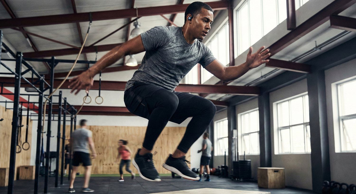 Sweat-resistant wireless earbuds used during gym workout